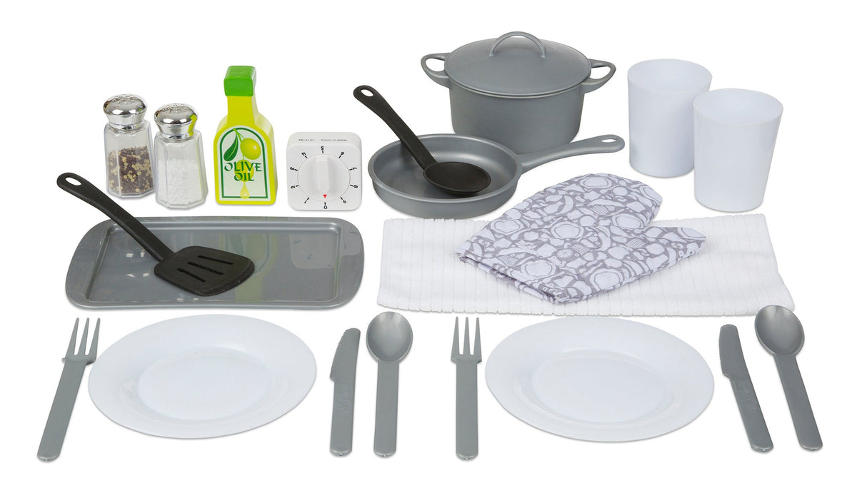 Top-down view of play kitchen accessory set with gray pots and pans, plates and utensils, salt and pepper, and two cups