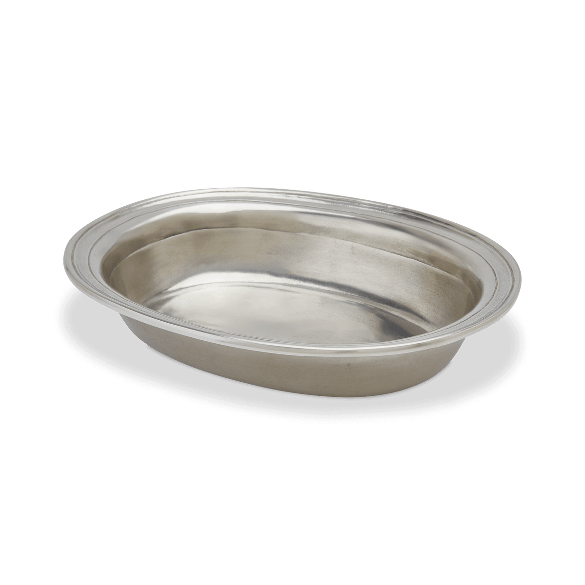 Three-quarter view of the Oval Bowl, Small showcasing its raised pewter rim against a black background