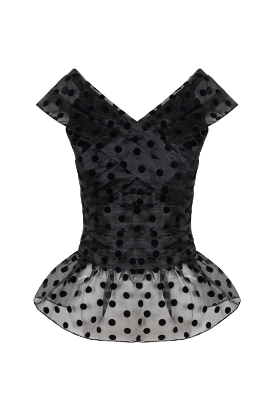Front view of Lily top with crossover V-neck, ruched bodice and sheer black polka-dot peplum on white background