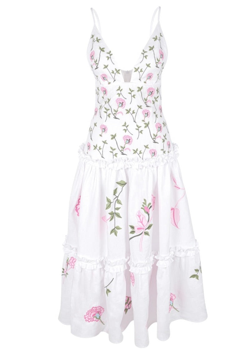 Front view of OTM Exclusive: Vaughan Dress showcasing adjustable spaghetti straps and pink floral embroidery on white tiers