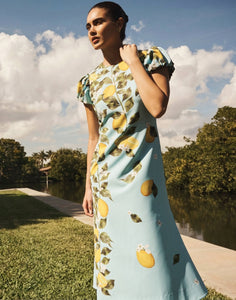 Perla Midi Dress in Sorrento Citrus stretch crepe with puff cap sleeves, crew neckline, and fit-and-flare silhouette.