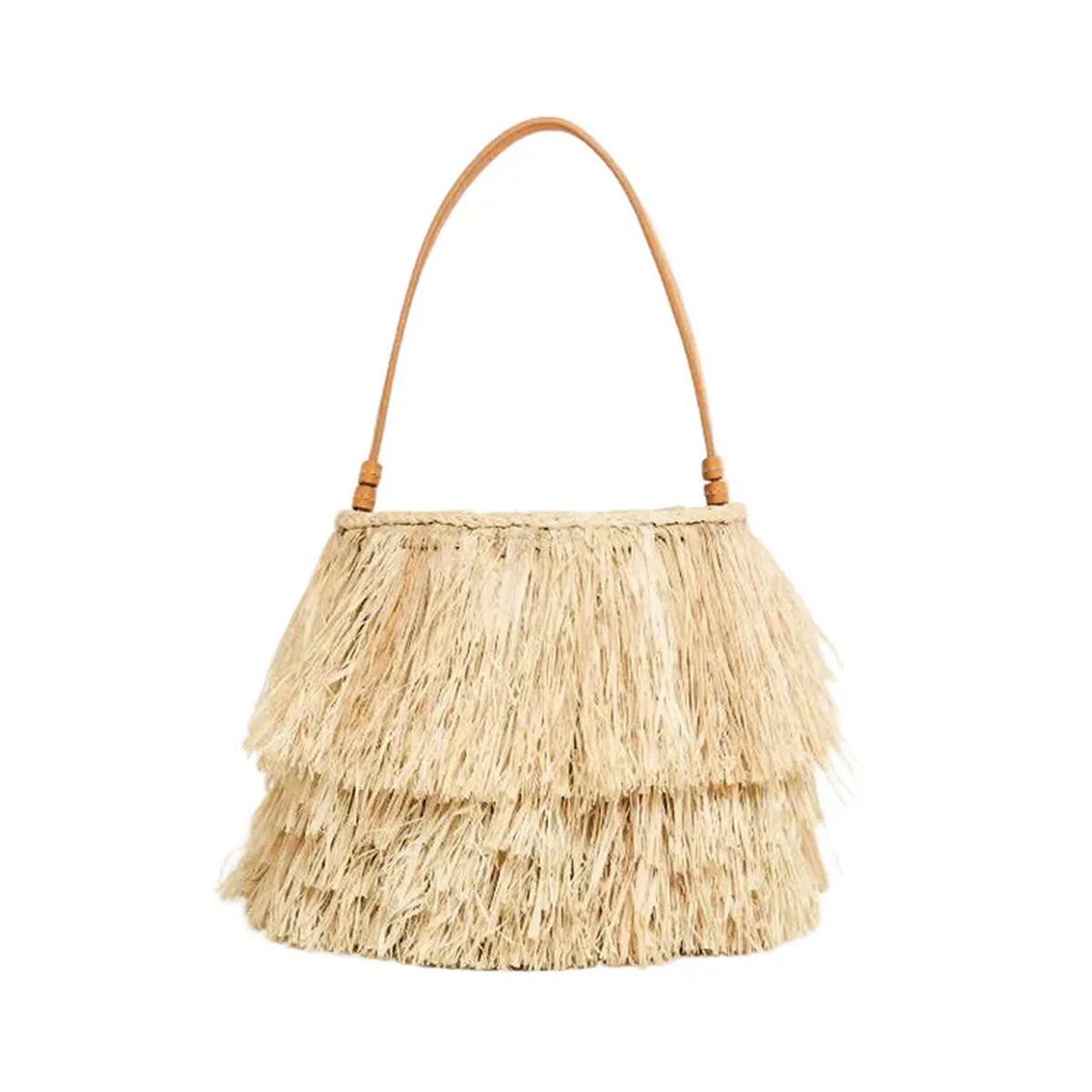Front view of Harbour Island bucket showcasing layered straw fringe and tan leather top handle on white background