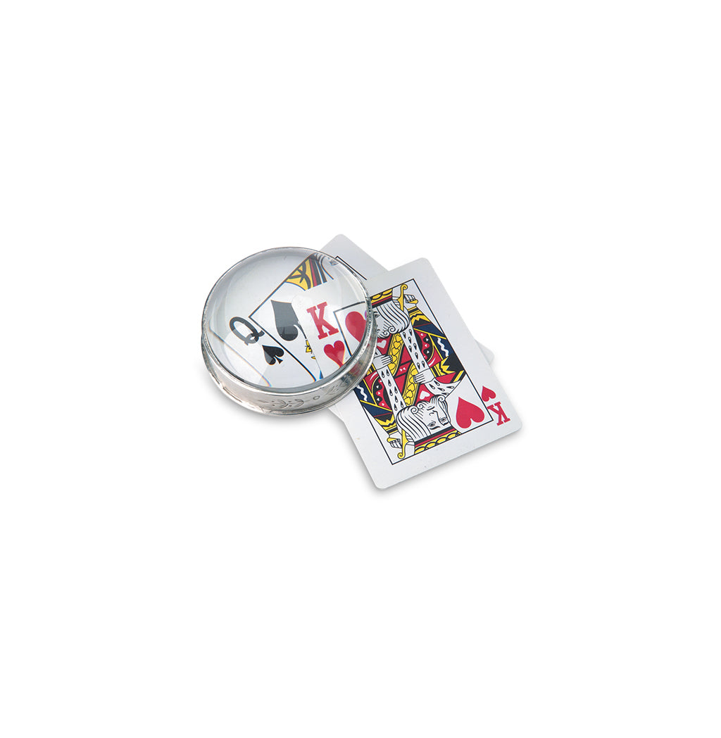 Top view of Garda Magnifying Glass, Large showcasing its round pewter frame over playing cards on a white background