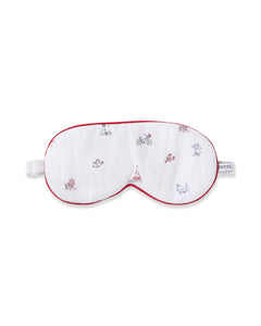 The Adults Twill Sleep Mask in Coastal Charms by Petite Plume features vibrant beach-themed prints like sunbathing and cycling. With white fabric and red trim, its a stylish sleep accessory, ideal for monogrammed gifts for beach lovers.