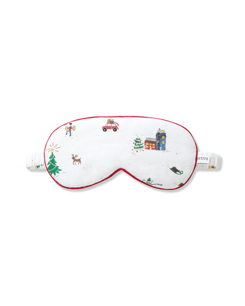 Front view of adult twill sleep mask showcasing Holiday Town village print and red piped trim on white background