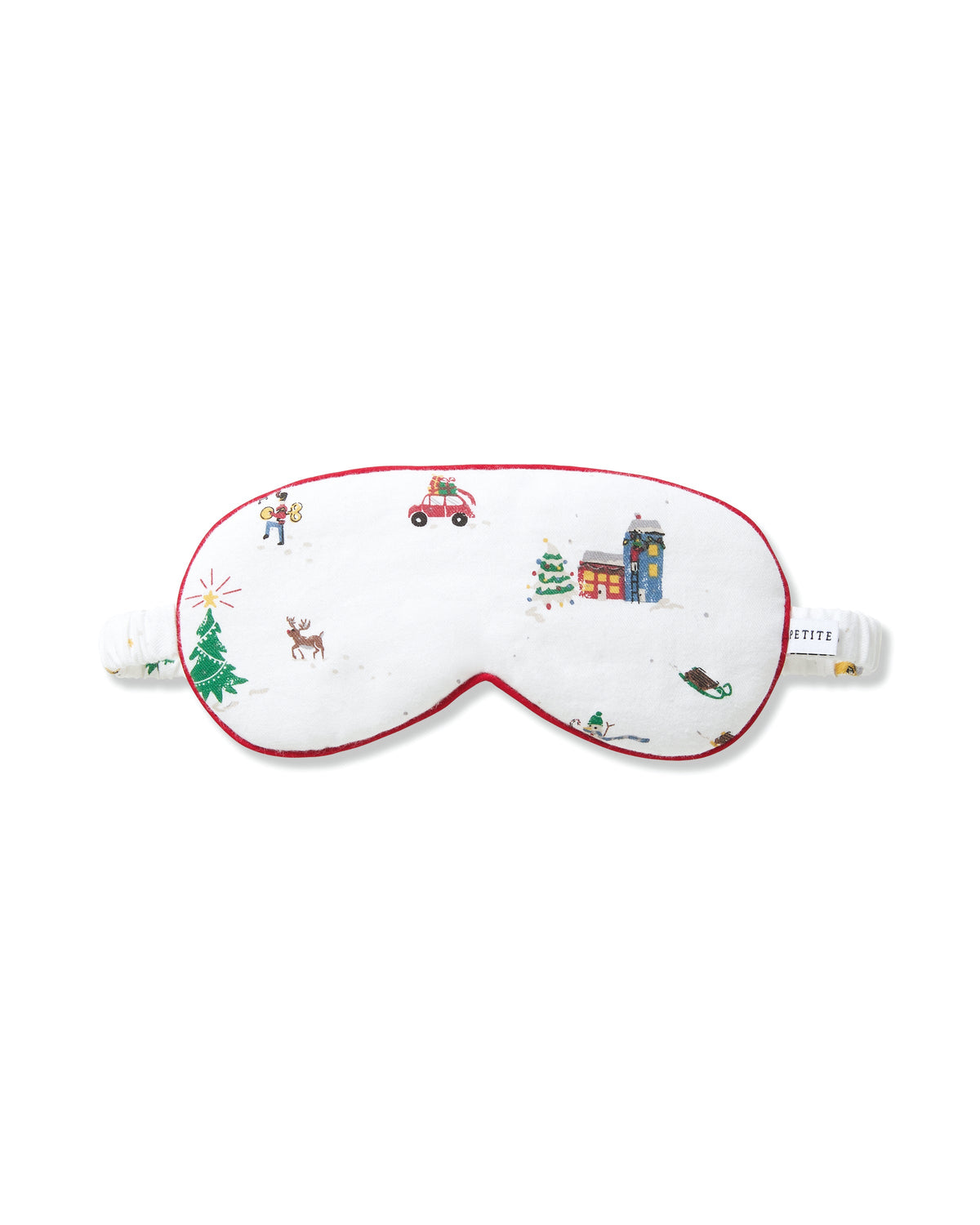 Front view of adult twill sleep mask showcasing Holiday Town village print and red piped trim on white background