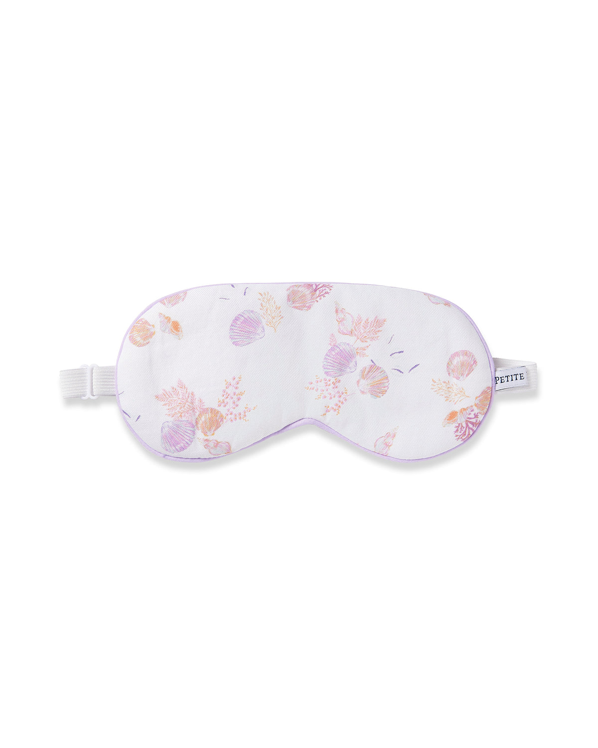 The Petite Plume Adults Twill Sleep Mask in Seashell Splendor features a white base with pink and purple seashell patterns, a matching eye mask, a white elastic strap, and refined purple piping. Ideal for monogrammed gifts.