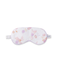 The Petite Plume Adults Twill Sleep Mask in Seashell Splendor features a white base with pink and purple seashell patterns, a matching eye mask, a white elastic strap, and refined purple piping. Ideal for monogrammed gifts.