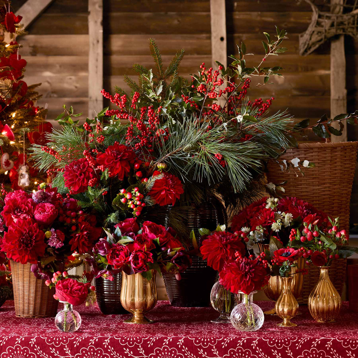 AERIN holiday florals in Pauline gold vases and bud vases and Calinda vases