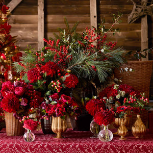 AERIN holiday florals in Pauline gold vases and bud vases and Calinda vases