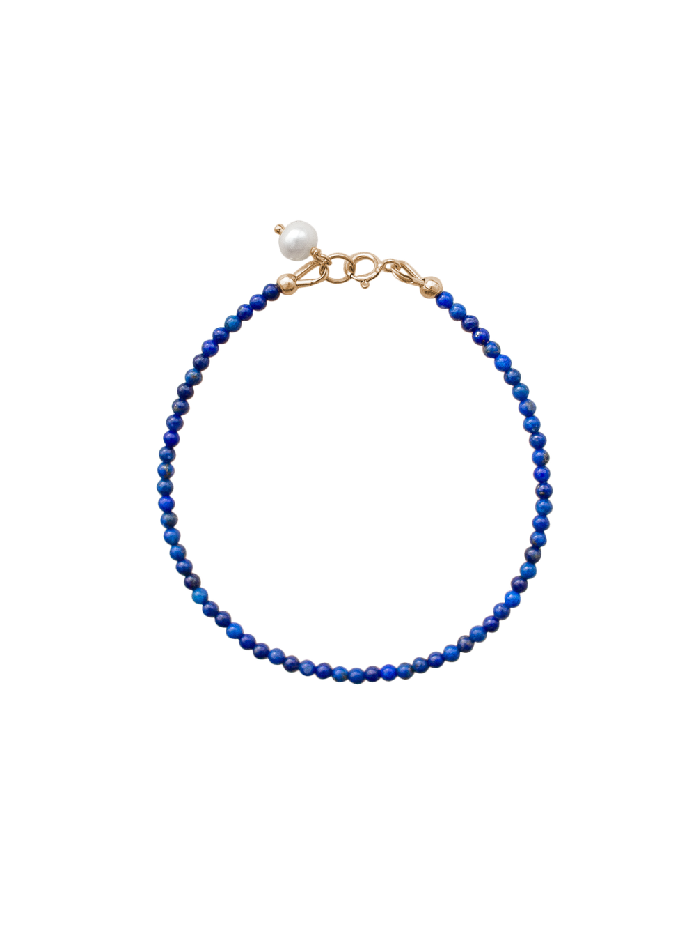 Top view of Alice Bracelet in blue showcasing lapis lazuli beads, a freshwater pearl charm, and gold-filled clasp