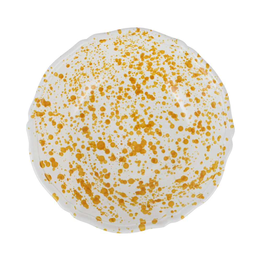 Top-down view of Amalfitana Splatter serving bowl showcasing yellow splatter pattern on white glaze with white background