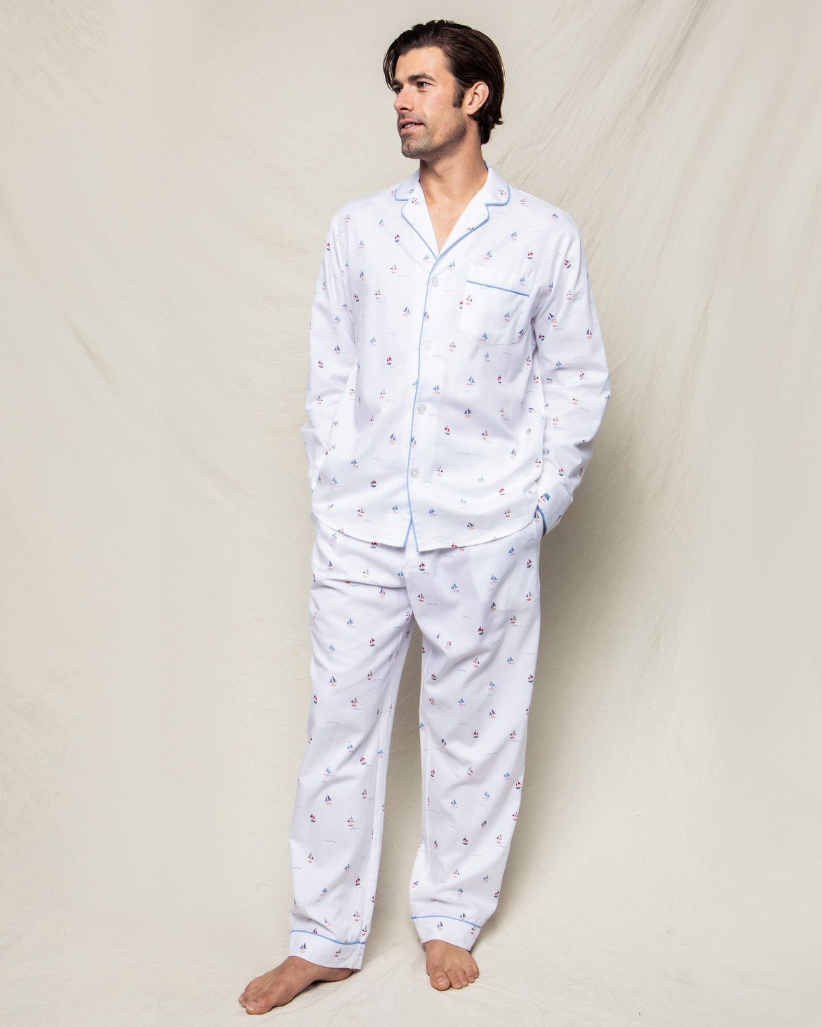 Front view of Men’s Twill Pajama Set in Bateau with sailboat print and contrast piping on a model against a cream backdrop