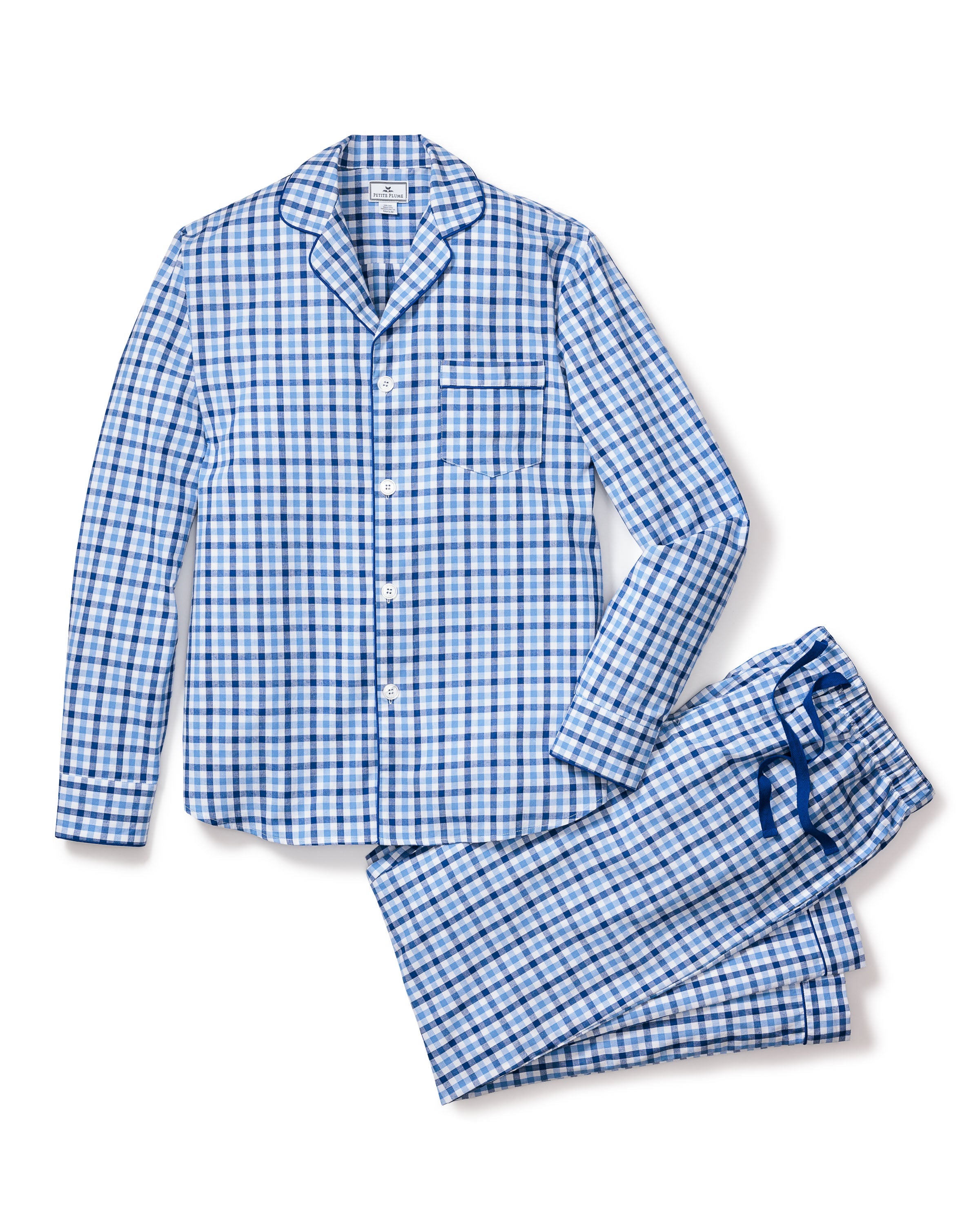 The Mens Twill Pajama Set by Petite Plume features a royal blue gingham print with a long-sleeve button-up shirt and front pocket, paired with matching drawstring pants for comfort and timeless elegance.