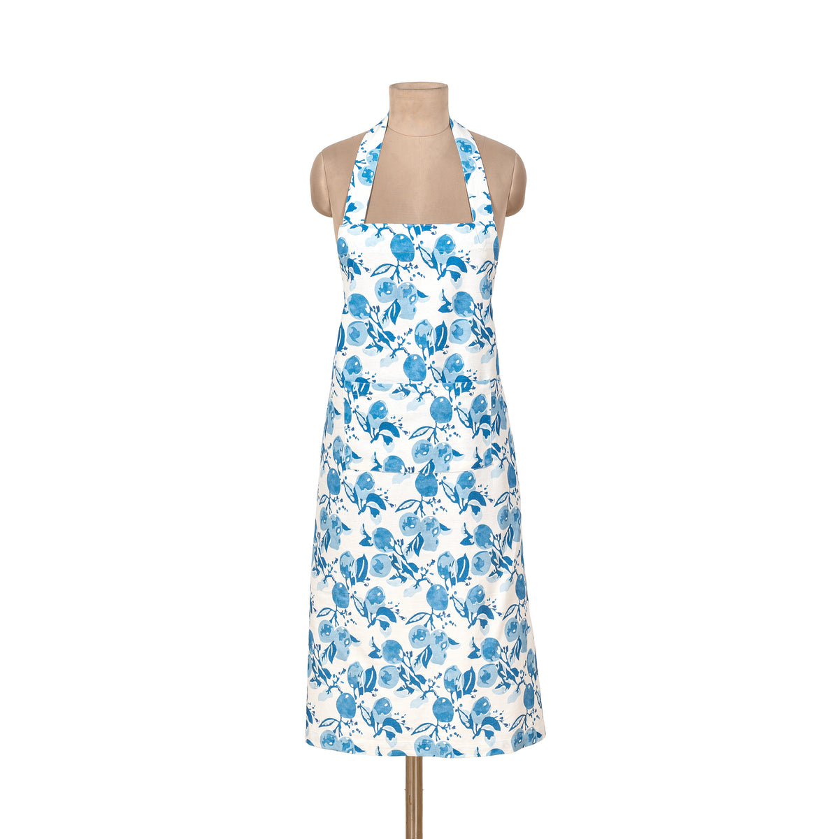 Front view of Citron Apron in Bleu showcasing blue citrus and lemon blossom pattern with a white background