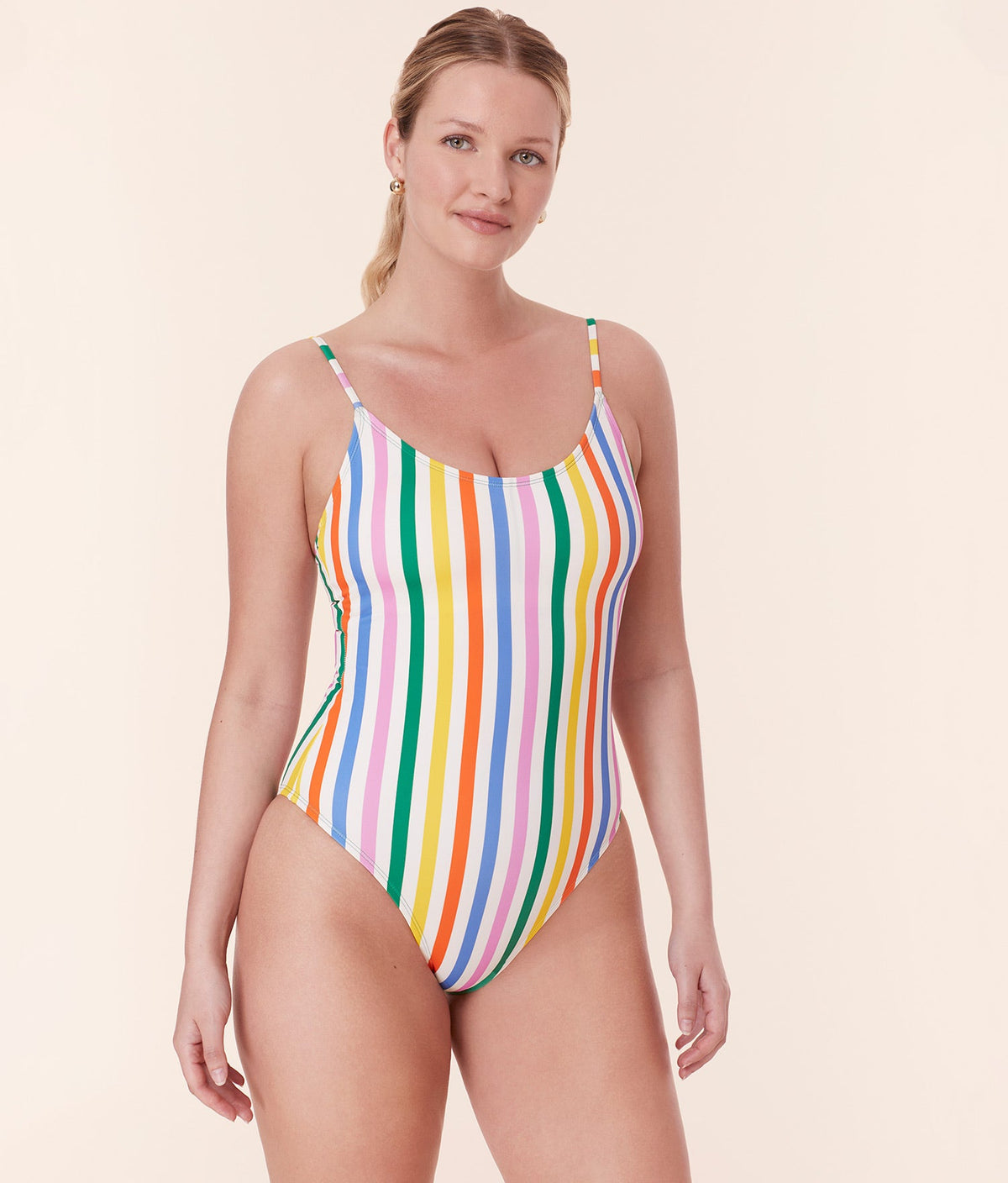 Front view of model in Andie Swim’s Amalfi One Piece - Rainbow Stripe, showcasing the colorful design and sculpting fit.