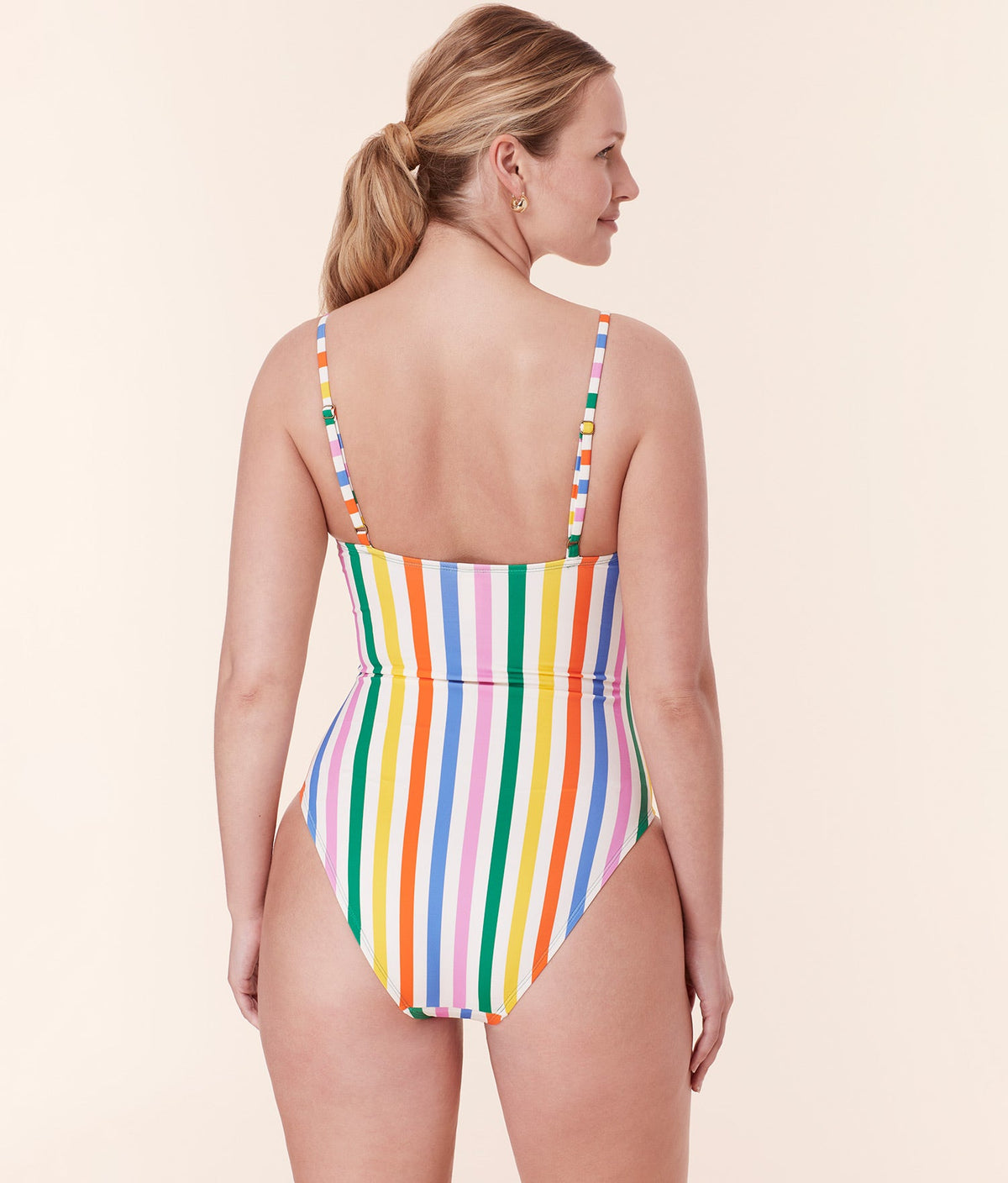 Andie Swim’s Amalfi One Piece in Rainbow Stripe from behind, emphasizing the adjustable straps and supportive underbust elastic.