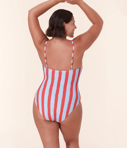 Model wearing Andie Swim’s Amalfi One Piece in Candy Stripe with adjustable straps and scoop neckline.