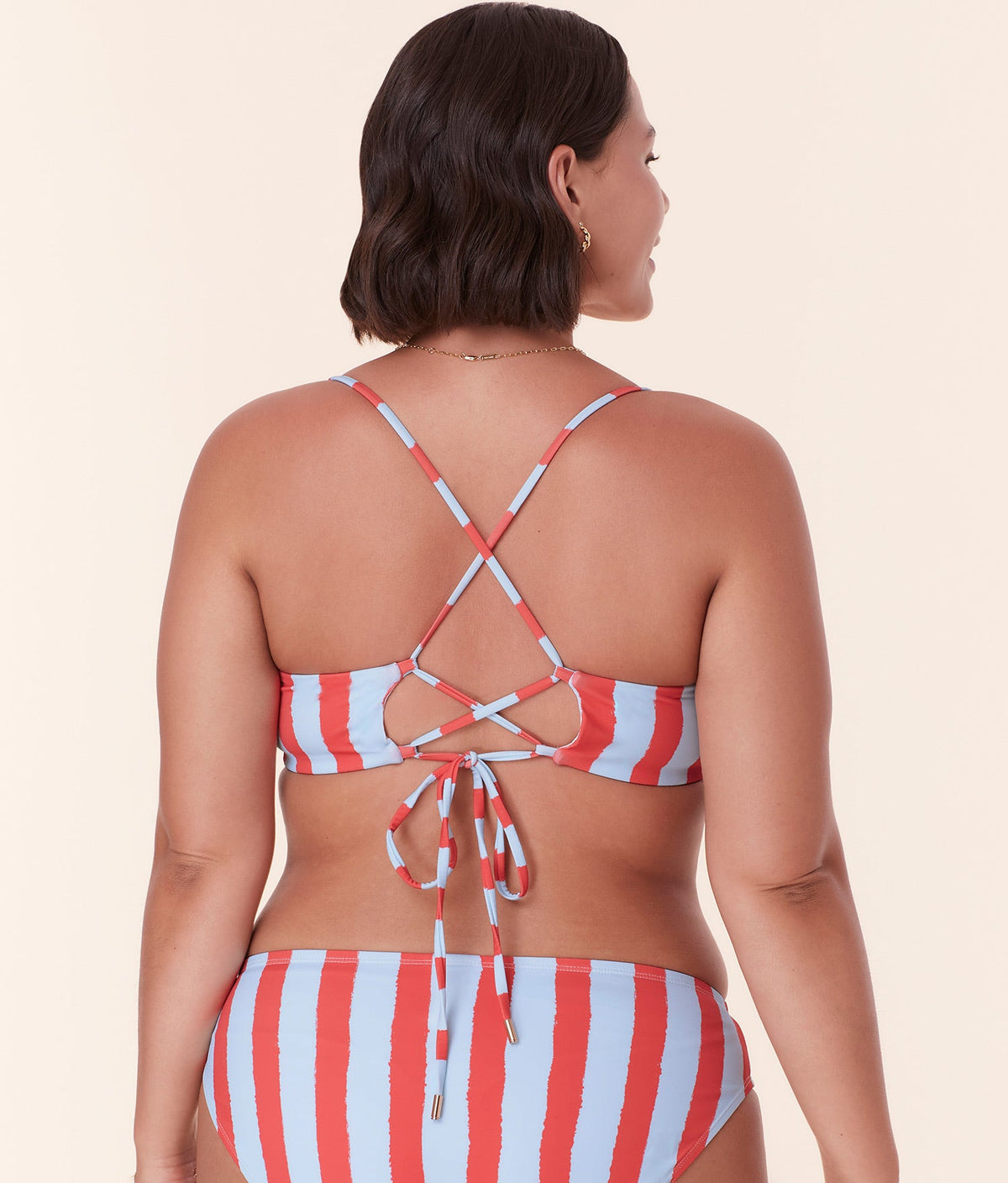 Back view of Andie Swim's Fiji Bikini Top in Candy Stripe, highlighting the criss-cross adjustable straps and tie-back design.