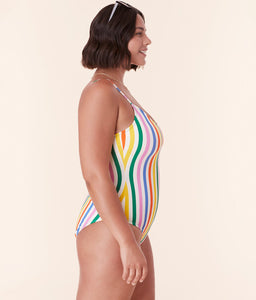 Side profile of model in Andie Swim’s Amalfi One Piece - Eco Nylon - Rainbow Stripe, showcasing the sculpting fit and colorful vertical stripes.