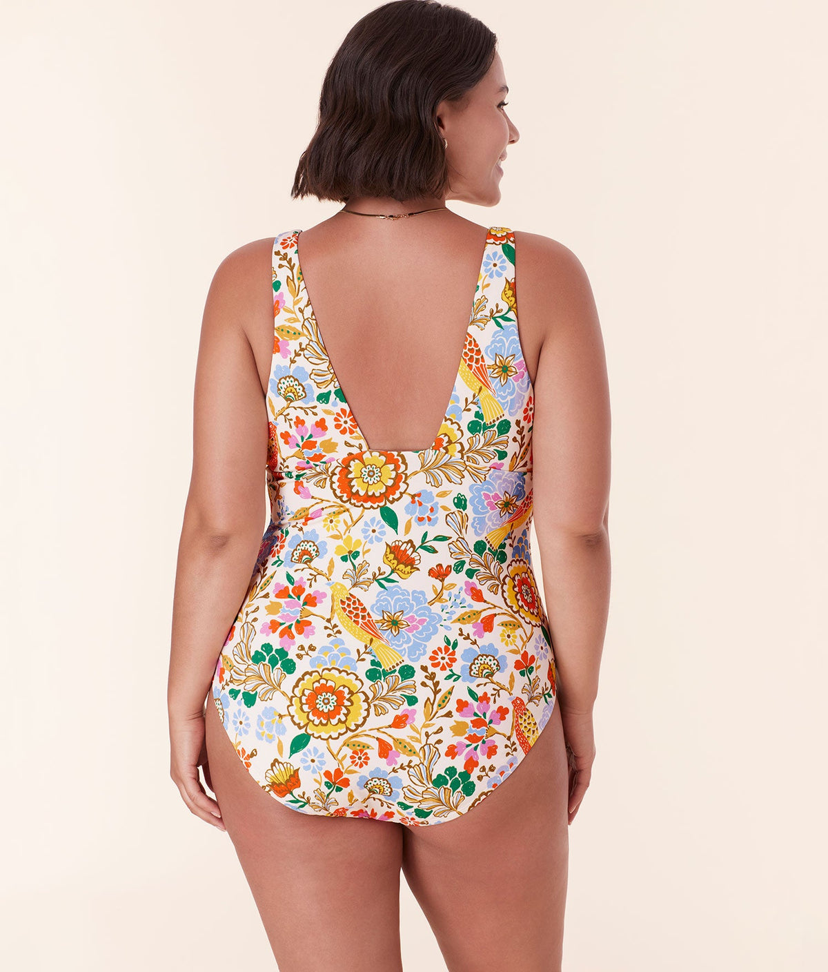 Back view of Andie Swim’s Augustine One Piece in Bird Floral, highlighting the low back design and wide supportive straps.