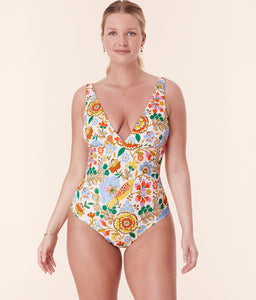 Front view of model in Andie Swim’s Augustine One Piece - Bird Floral, emphasizing the vibrant floral design and full seat coverage.