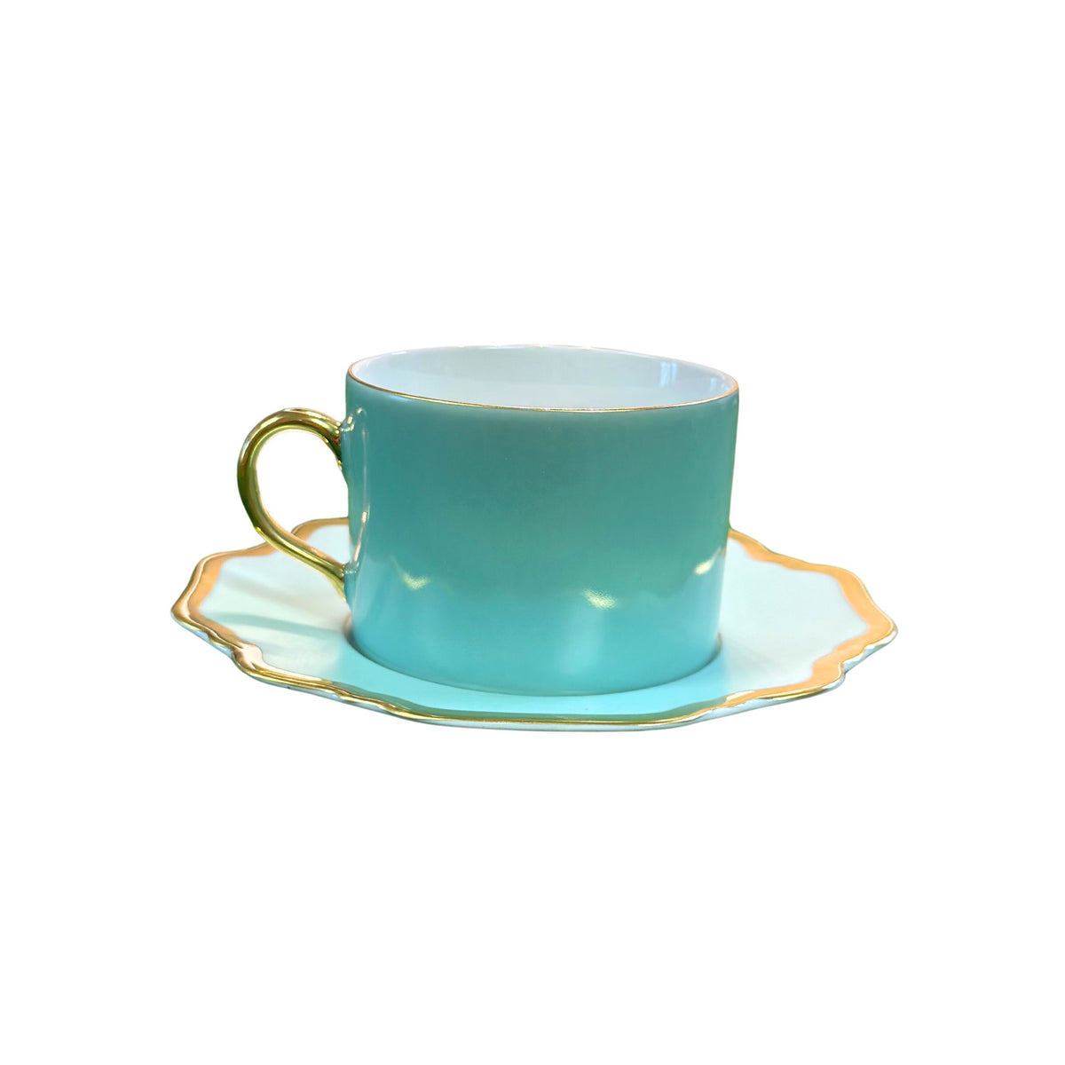 Front view of Anna’s Palette Tea Saucer in Aqua Green showcasing soft green trimming and golden rim beneath a teacup on white