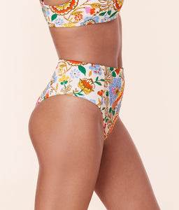 Side view of model in Andie Swim Bird Floral High Waist Cheeky Bikini Bottom, highlighting the high waist and cheeky fit.