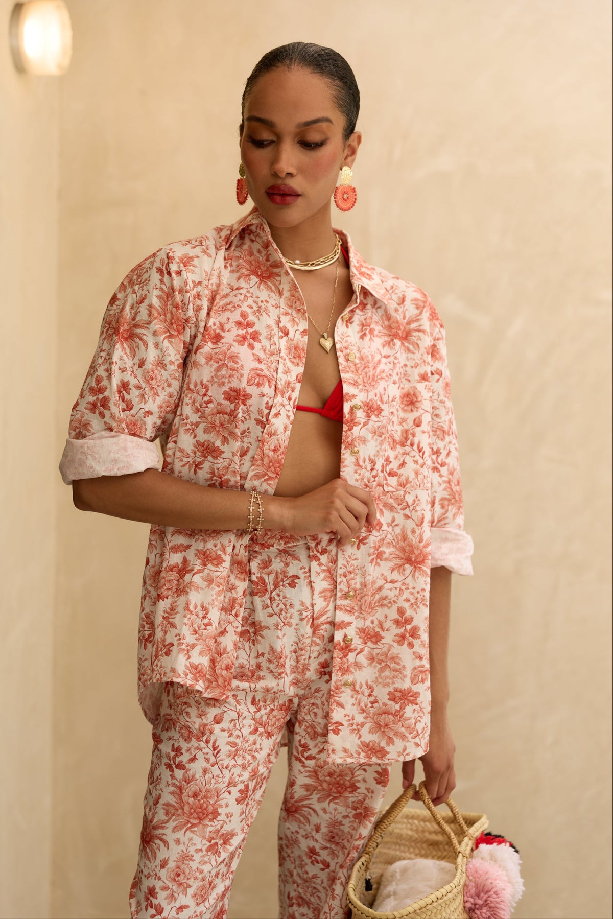 Front view of The Austin Shirt in Red Toile showcasing its oversized fit and gold hammered buttons on a model