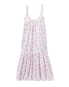 The Womens Twill Chloe Nightgown in Seashell Splendor by Petite Plume is a sleeveless, flowy white dress with thin straps, a floral pattern in pink, purple, and light orange, a ruffled hem, and an empire waistline—ideal for those who appreciate luxurious sleepwear.