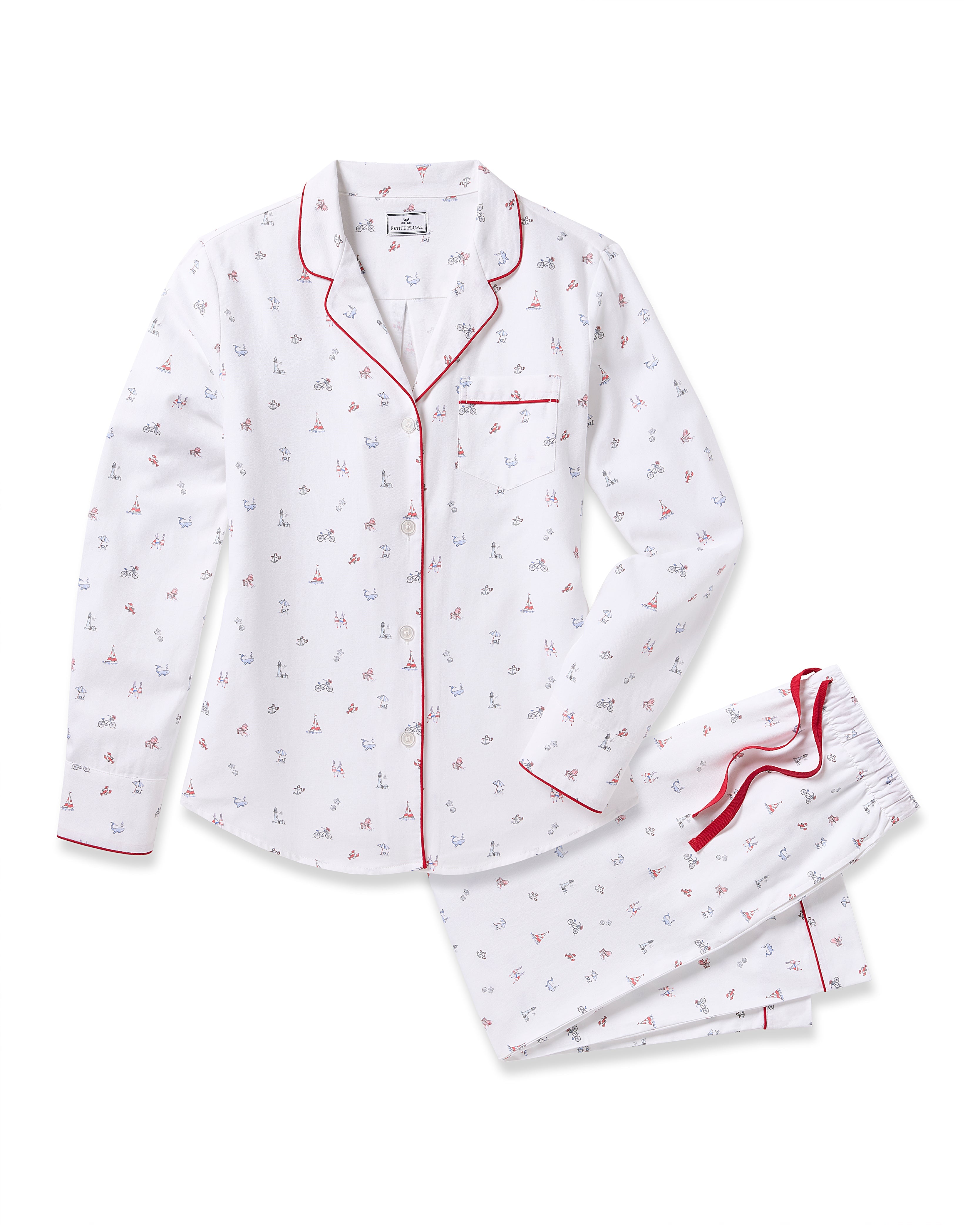 Discover the Womens Twill Pajama Set in Coastal Charms by Petite Plume. Featuring a nautical theme with sailboats and anchors on luxurious white cotton, this set includes a long-sleeved button-up top with red piping and matching elastic-waist pants for ultimate comfort.
