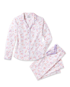 Indulge in luxury with Petite Plumes Womens Twill Pajama Set in Seashell Splendor, featuring yarn-dyed white cotton adorned with pink and purple floral patterns. This set includes a long-sleeve button-up top with a collar and chest pocket, plus matching pants with a purple drawstring.