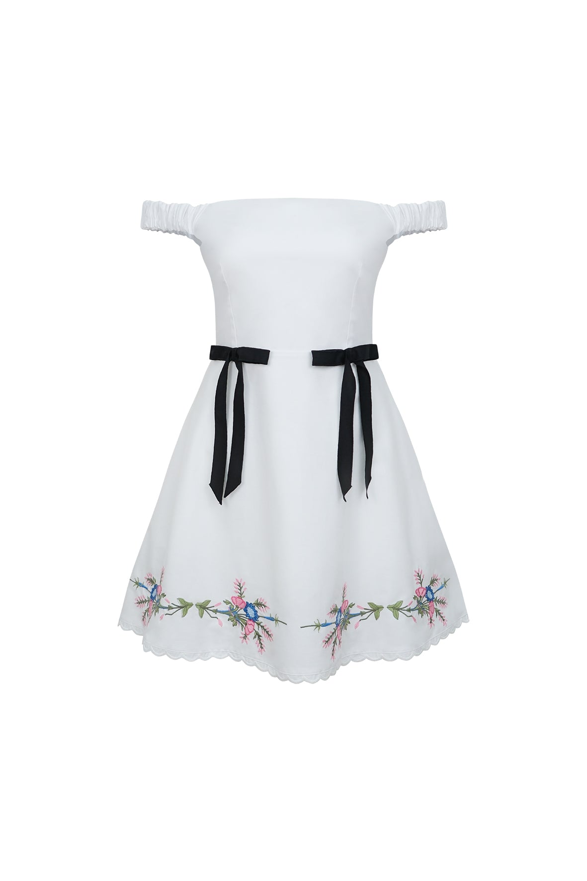 Front view of Aycan dress showcasing white off-the-shoulder bodice, black waist bows and floral embroidered hem on white