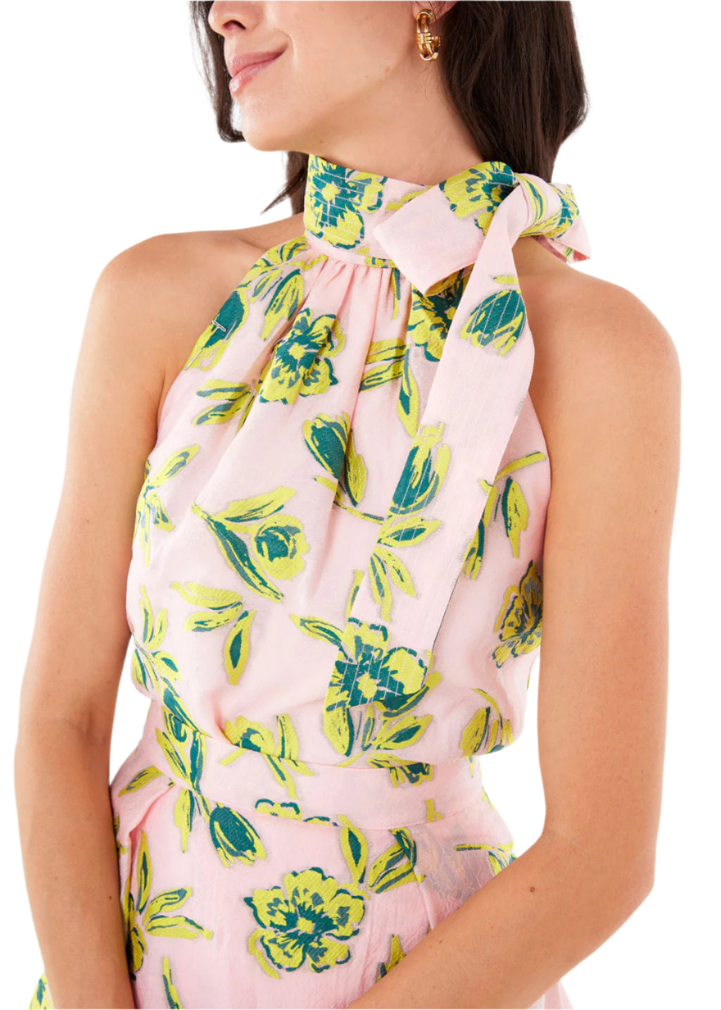 Close up front view of Rory Top in pink tropical tulip jacquard showcasing halter high neck with tied bow and sleeveless fit against white background