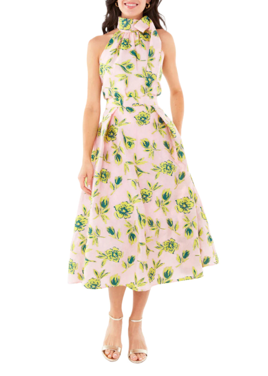 Front view of Eden Midi Skirt in pink tropical tulip jacquard showing a pleated flared fit on model against white