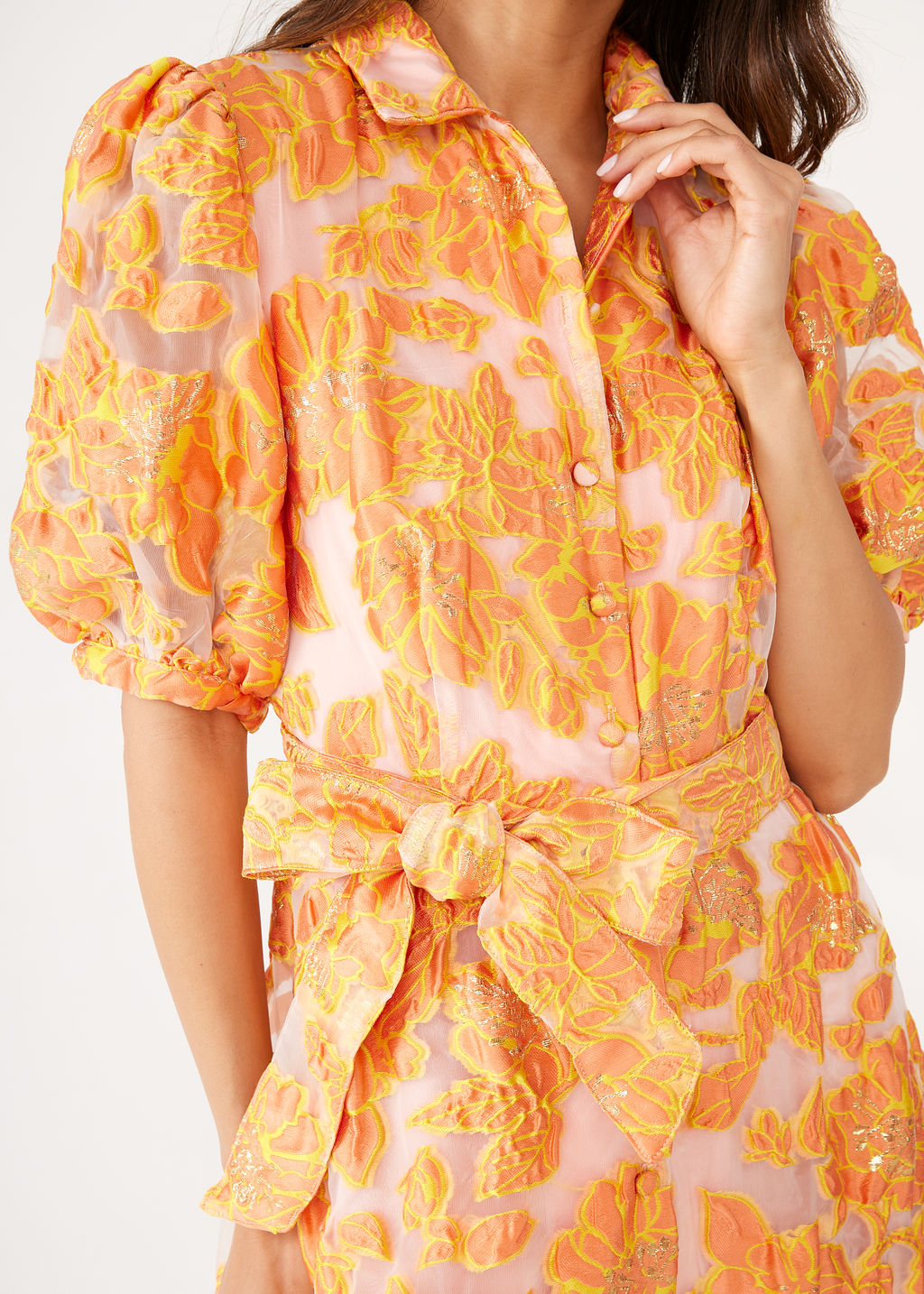 Close-up of Charlotte Gown in Orange Blossom Organza showcasing collared neckline, gathered cuffs, and self-tie belt