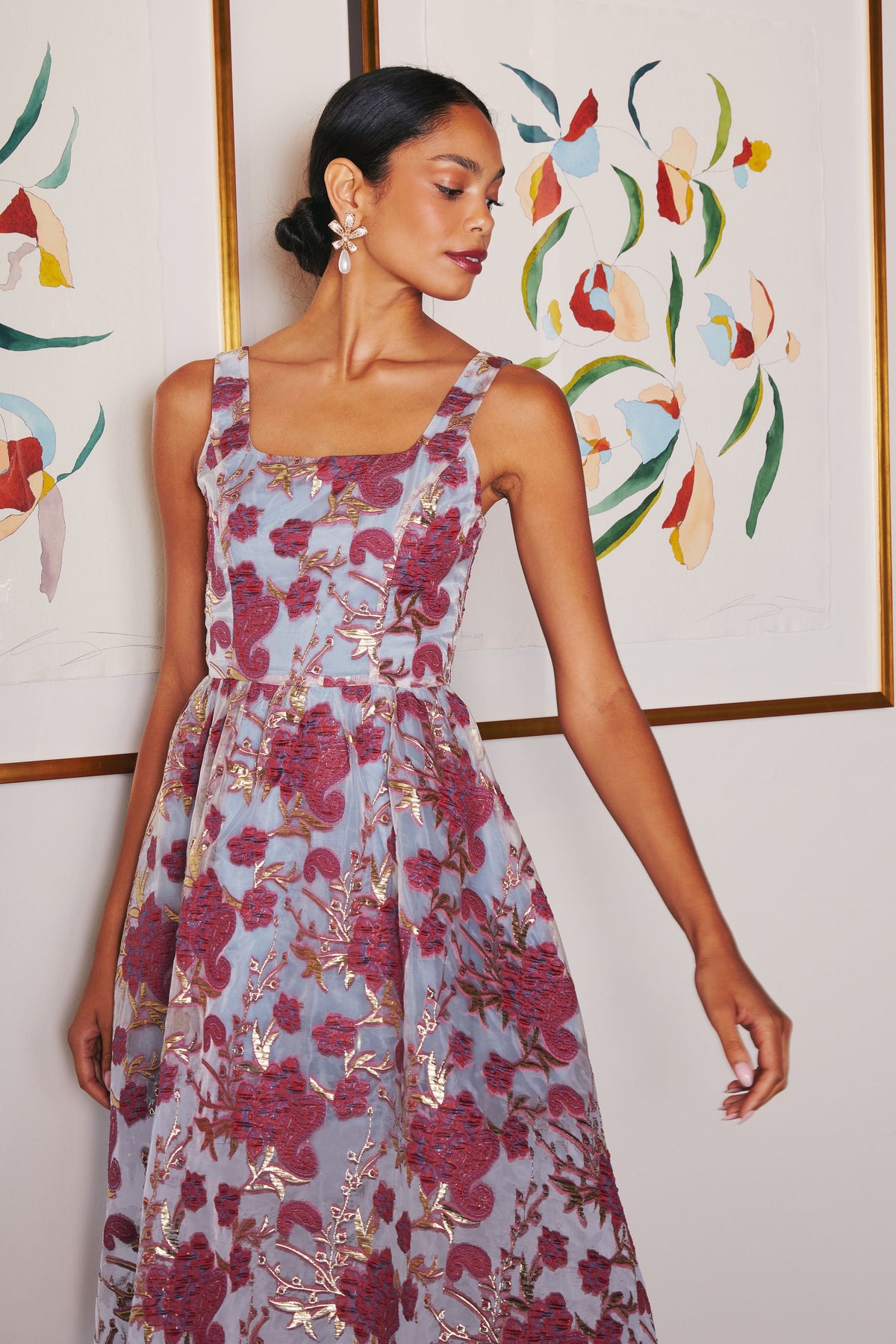 Front view of Victoria Dress Moonlight Petal Organza showcasing floral metallic organza against floral artwork