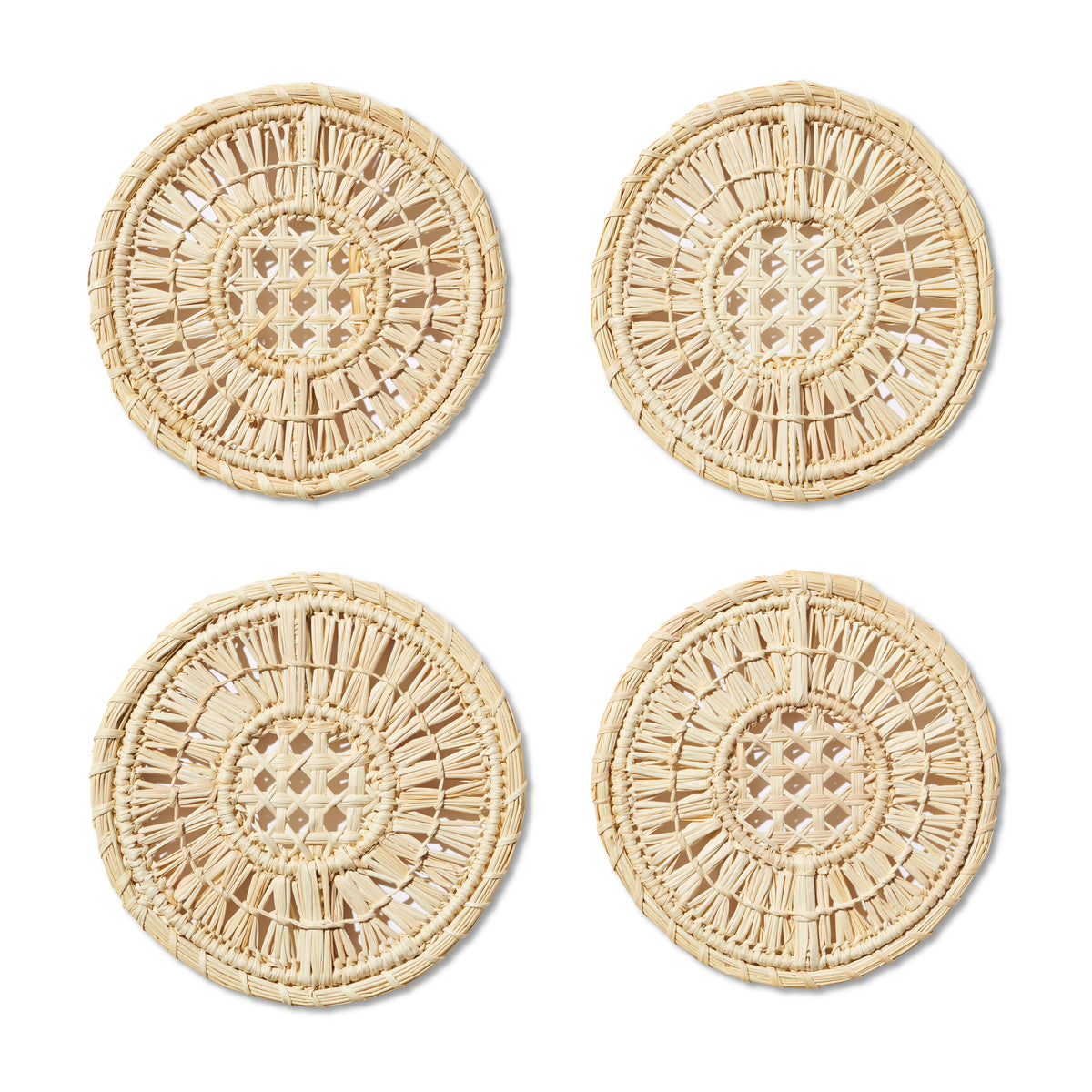 Overhead view of Ada raffia coasters set of four showing woven natural raffia texture on white background