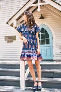 The Addison drop waist shirt dress has a crisp collar, delicate button placket in  fall floral navy.