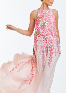 Pink evening halter  gown with cascading bow in rear. Dripping pink wisteria print on front. 