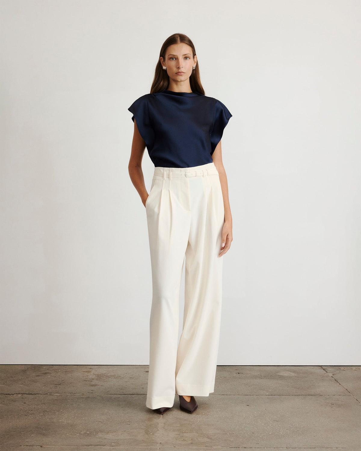Front view of Adrien Top on model showing draped neckline, flutter sleeves, satin crepe in anthracite on light background