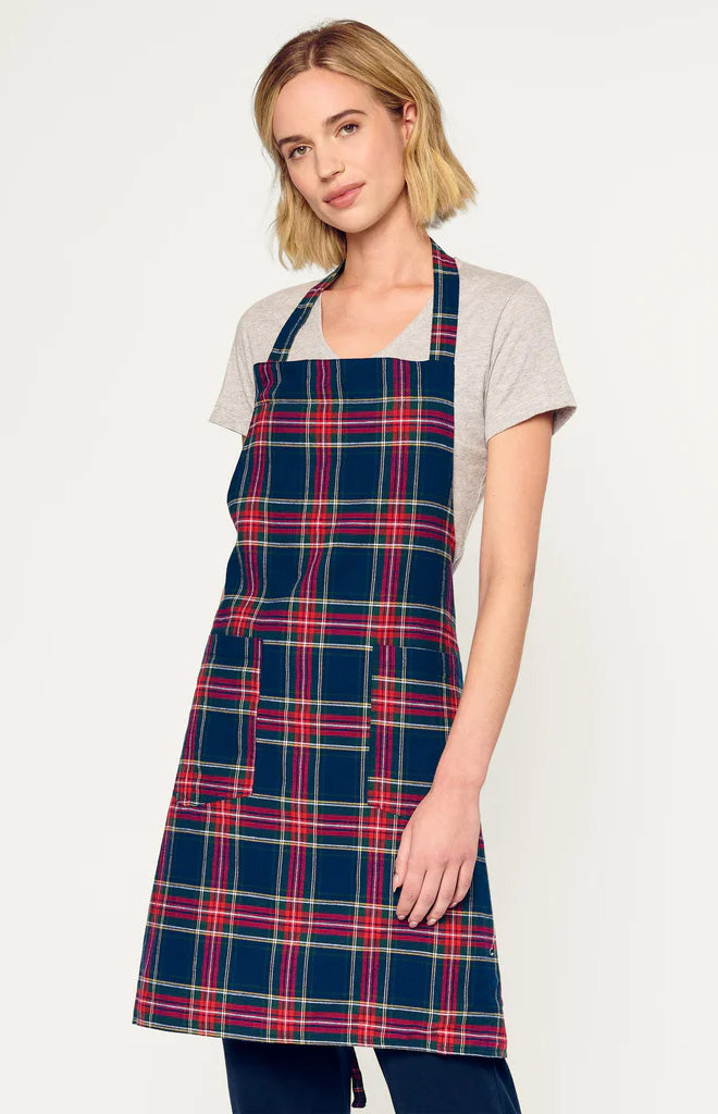 Front view of Adult Apron in Windsor Tartan showcasing navy tartan plaid, two front patch pockets, and neck strap on a light background