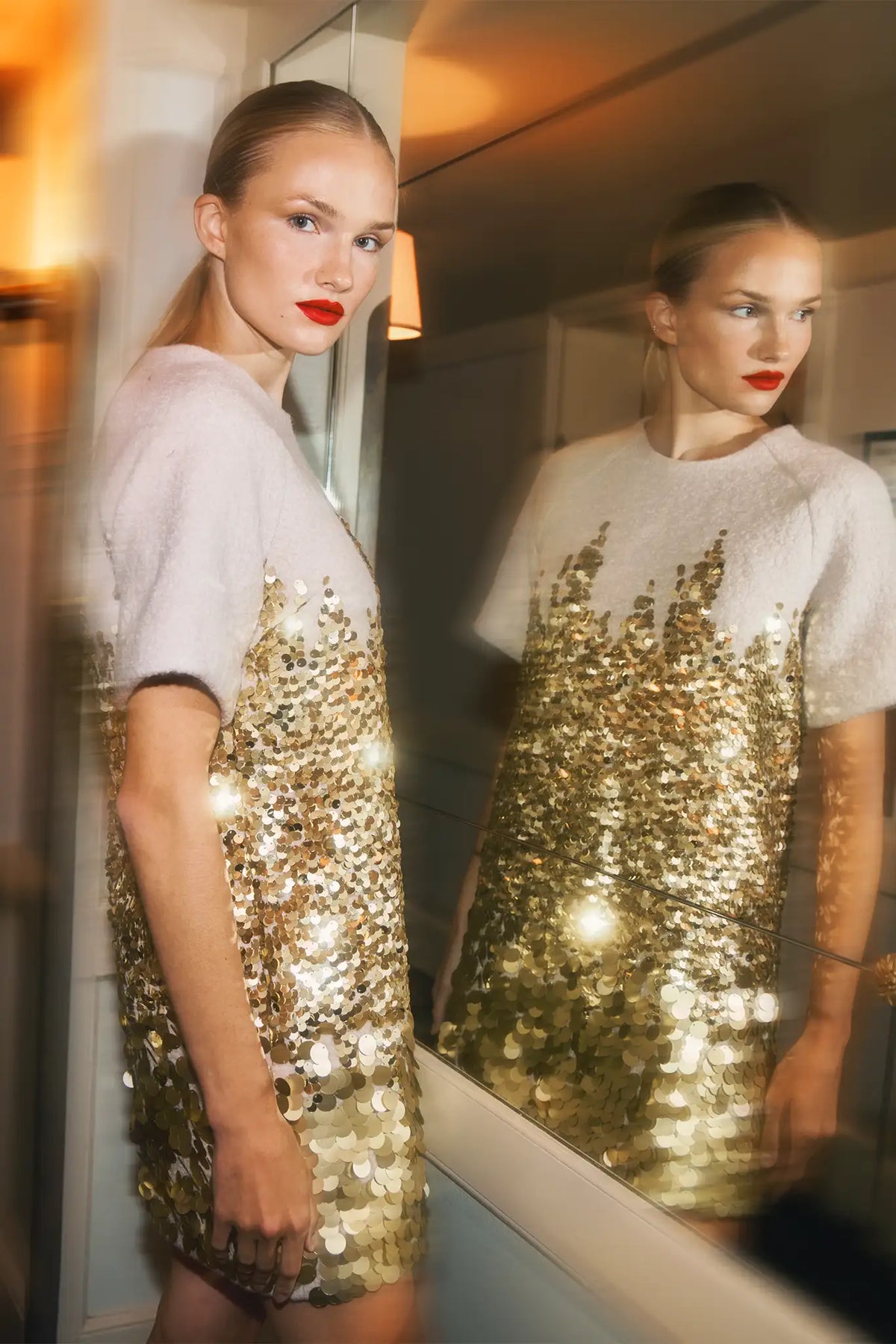 The Aerin Dress is crafted from Italian wool embroidered with cascading gold paillettes. 