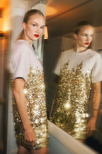 The Aerin Dress is crafted from Italian wool embroidered with cascading gold paillettes. 