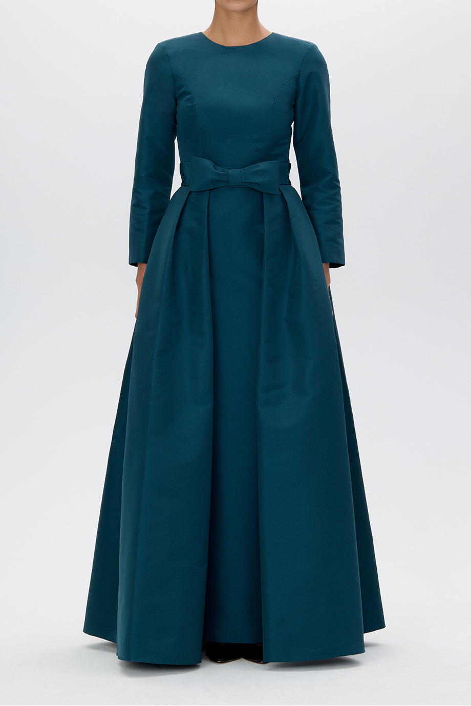 Front view of Cristina silk faille column gown, teal, showcasing long sleeves, waist bow and pleated full skirt