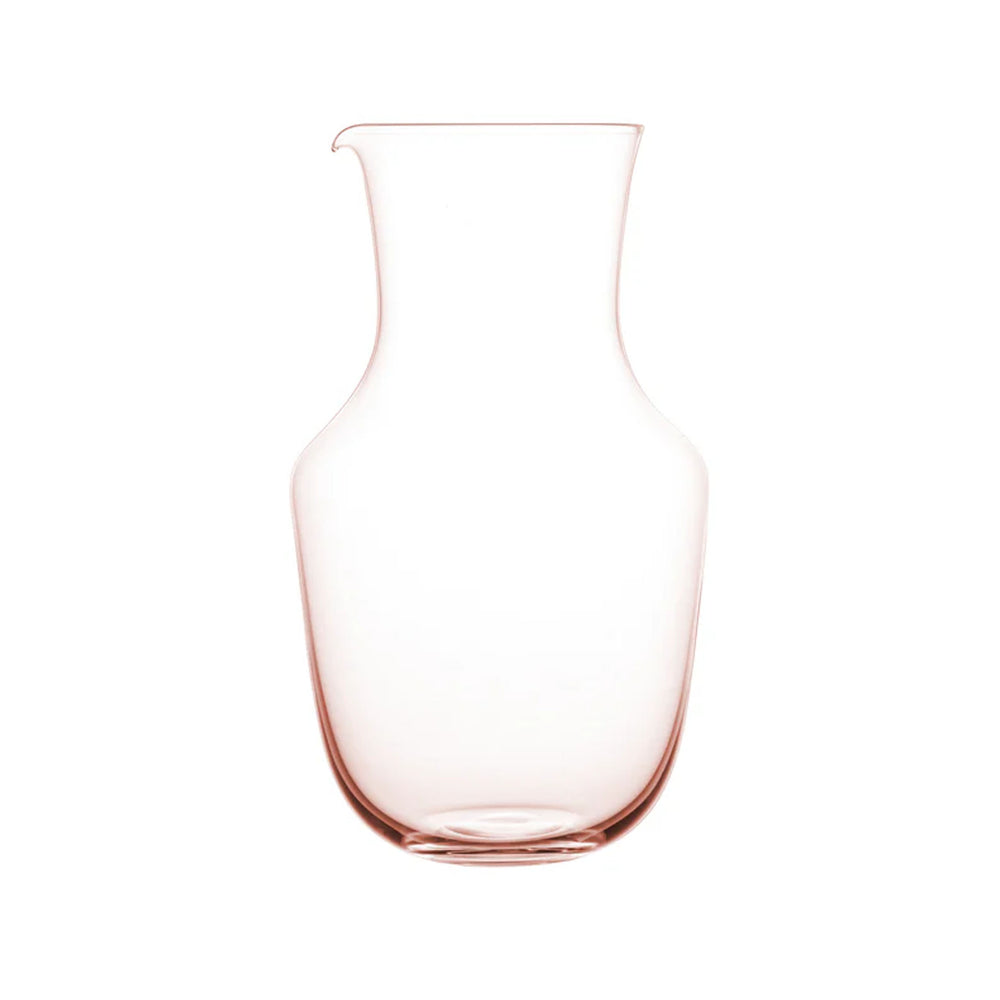 Front view of Alpha Water Pitcher in Rosalin showcasing rose-tinted hand-blown crystal and flared spout on white background