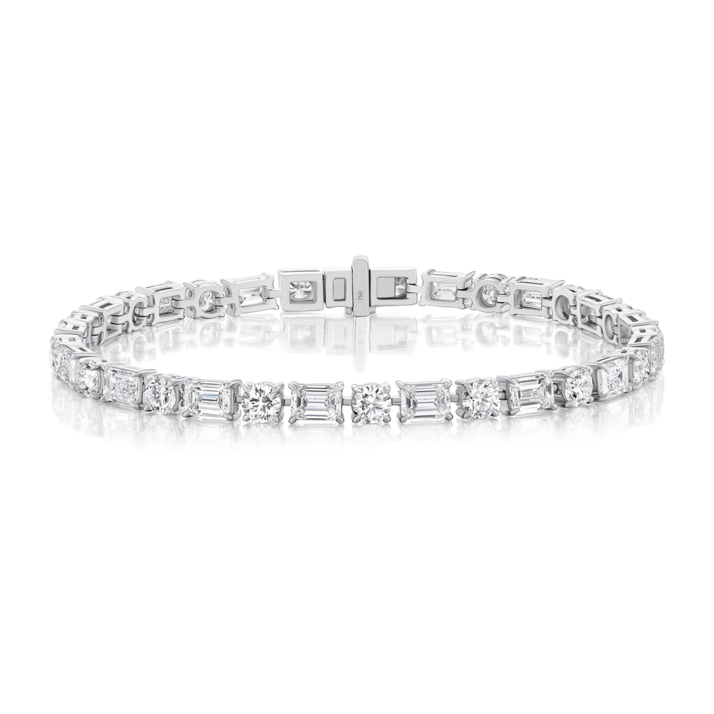 The Alternating East-West Set Round and Emerald Cut Diamond Tennis Bracelet in White Gold is shown against a white background.