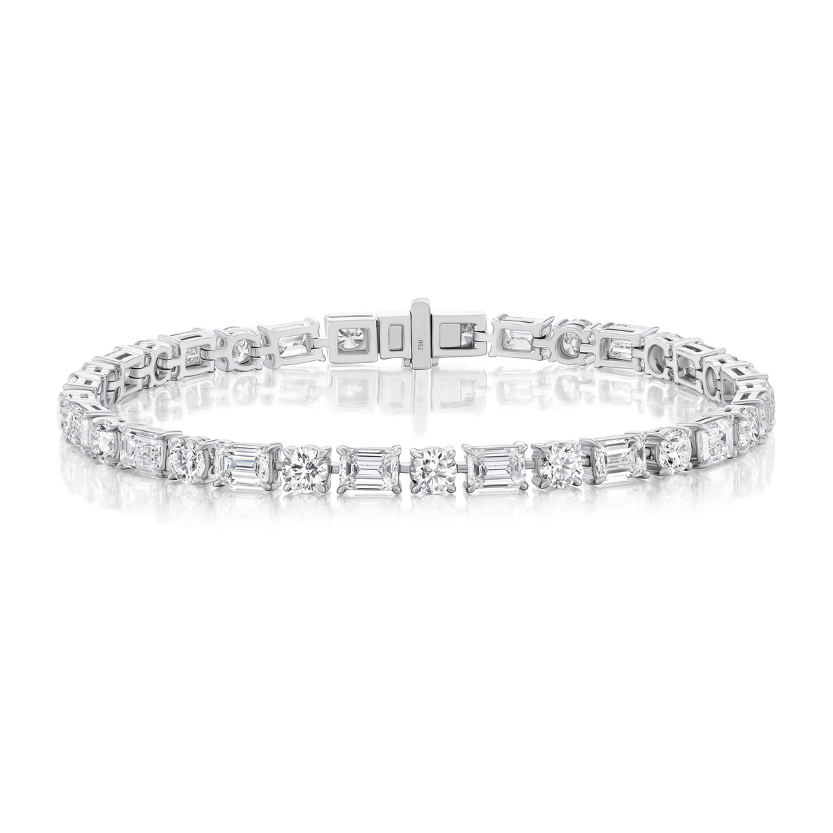 The Alternating East-West Set Round and Emerald Cut Diamond Tennis Bracelet in White Gold is shown against a white background.