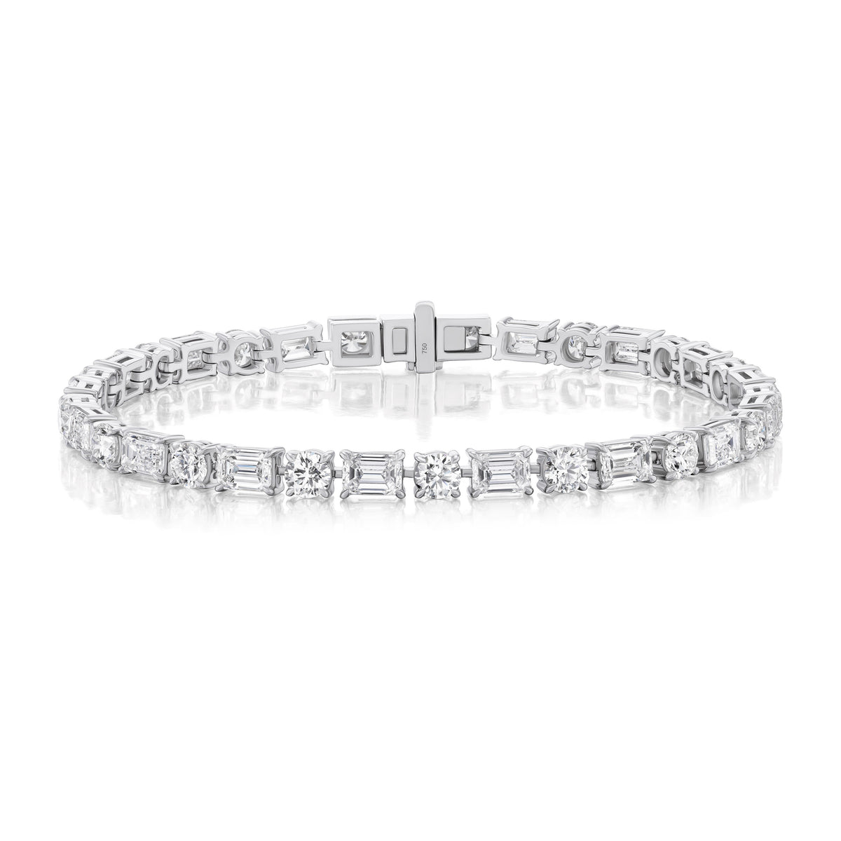 The Alternating East-West Set Round and Emerald Cut Diamond Tennis Bracelet in White Gold is shown against a white background.