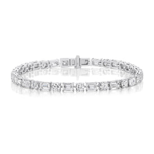 The Alternating East-West Set Round and Emerald Cut Diamond Tennis Bracelet in White Gold is shown against a white background.